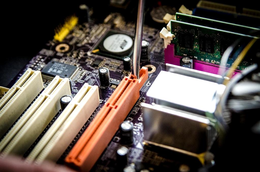 Holographic interface displaying 3D computer component repair visualization